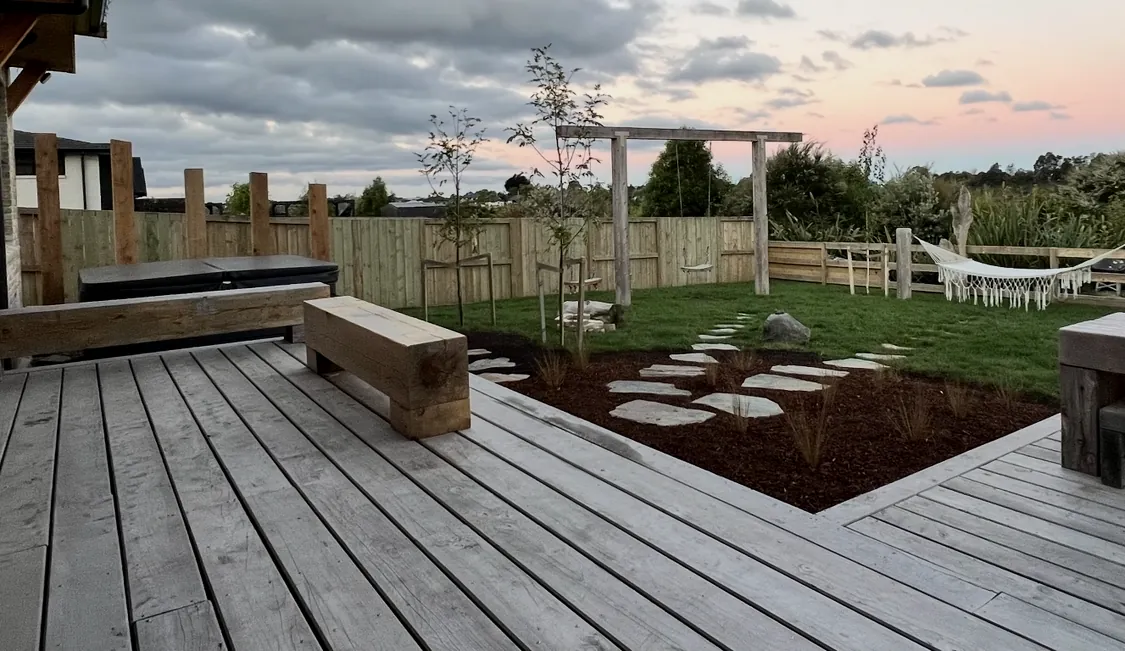 Deck, garden and pergola at dusk